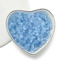 Light blue translucent 4mm acrylic peanut beads displayed in a white ceramic heart bowl - Matte Blue