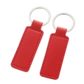 Pair of bright red rectangular leather keychains with red stitching and silver metal rings - Stitched Rectangle-Red