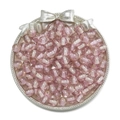 Macro shot of 10mm pink glitter resin beads with white stripe core in vintage silver tray - Purple