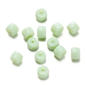 Detailed view of light green translucent cylinder glass beads with smooth polished finish - 1 String (Approx. 60 Pcs, 6x8.5mm) / Solid Light Green