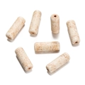 Detailed view of seven tube-shaped synthetic white turquoise beads for DIY jewelry making - Long Tube Shaped Bead (11) / 1 Piece / Creamy White with Brown Veins