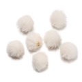 Close-up of seven cream faux mink fur pompom charms with gold metal loops for DIY jewelry - 10 Pieces/Pack (17mm Diameter) / Off-white