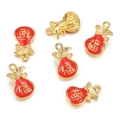 Macro detail of gold-plated lucky bag pendants with red enamel and Fu character - Blessing Bag / 2 Pcs/Set