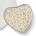 Milk white peanut-shaped 4mm acrylic beads for DIY jewelry in a heart-shaped bowl - Solid Cream White