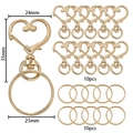 Set di moschettoni a cuore dorati con dimensioni 24x35mm e anelli piatti in dettaglio - 10 Chiusure E 10 Anelli / Oro KC