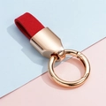 Close-up of red suede leather key ring loop with rose gold polished metal spring clasp - 1 Piece / Gold Red