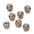 Macro detail of vintage silver and gold plated alloy beads with relief cloud patterns - 1pc/pack / Style 06 (Large Hole Spacer)
