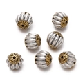 Detailed view of silver and gold alloy barrel beads with Tibetan style cloud patterns - 1pc/pack / Style 09 (Ribbed Cap Bead)