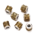 Detail view of 7 pieces of silver and gold plated Tibetan spacers with clover relief - 1pc/pack / Style 16 (Vintage Cross Flower)