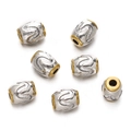 Macro view of silver alloy beads with wave patterns and gold-rimmed edges for jewelry - 1pc/pack / Style 20 (Embossed Wave Barrel)