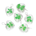 Detailed view of heart-shaped glass pendants with real dried four-leaf clovers inside - Heart Style / 2 Pcs/Set
