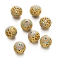 Macro shot of seven gold cloisonne hollow beads with colorful enamel floral patterns - Gold Pink Blue Green Flower (Copper Style 11, 1 Piece/Approx. 2.5g)