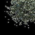 Close-up of iridescent light green glass shards for DIY nail art on black background - Dark Olive Green (50g)