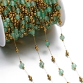 Detail of faceted light green stone beads with gold metal accents on a spool for DIY jewelry - Light Green Prehnite Style (Gold Chain) / Gold Style 04