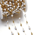 Macro detail of white marble faceted beads with gold spacers on DIY jewelry chain - Gold Style 11
