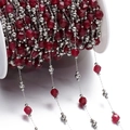 Macro detail of ruby red faceted stone beads and stainless steel DIY jewelry chain - Steel Style 05
