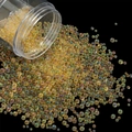 Macro shot of iridescent champagne glass beads pouring from a bottle on black background - 28g per Box / Yellow