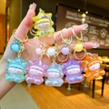 Star-shaped Lilith charms with iridescent glitter and colorful resin held in hand - Gold Hardware Electroplated Star Person / Aurora Mixed Colors