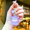 Detailed macro of a purple resin star doll keychain with glitter and gold metal hardware - Gold Hardware Electroplated Star Person / Aurora Purple