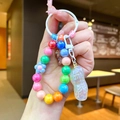 Porte-clés perlé mignon avec perles colorées et un grand pendentif cacahuète nacré - Style Aléatoire / Perlage Blanc Cacahuète Électroplaquée