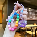 Détails du porte-clés en perles arc-en-ciel avec cœur scintillant et nœud rose - Perles de Nœud Aléatoires / Cœur Perles Violettes