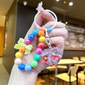 Detail of colorful beaded keychain with heart liquid glitter sand charm and bow - Random Bowknot Beads / Red Gradient Beads Heart