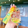 Macro detail of the yellow rabbit moon keyring featuring sparkling liquid quicksand and stars - Yellow Luminous Bubble Bead Star Moon Rabbit