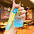 Blue liquid-filled backpack keychain with star sequins and yellow silicone strap - Blue Luminous Bubble Bead Backpack