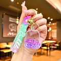 Purple glitter oil dolphin keychain with mini backpack pendant and gradient wrist strap - Purple Luminous Bubble Bead Backpack