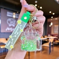 Green liquid quicksand castle keychain with Happy Moments silicone strap and gold ring - Green Luminous Bubble Bead Castle