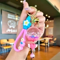 Porte-clés cœur rose avec boule d'étoiles liquides et lanière florale pour sac - Carillon Éolien Lumineux Rose