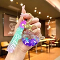 Detail of whale liquid quicksand keychain with purple sequins and golden bell accessory - Gradient Rope [purple] Glow-in-the-dark Snowflake Whale