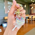 Handheld creative lollipop keychain with star sequins and golden bell accessory - Noctilucent White Lollipop