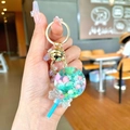 Pink lollipop keychain with mint accents, gold bell and sparkly bow bag charm - Blue Snowflake Lollipop
