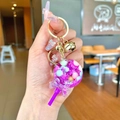 Purple lollipop oil keychain with glitter, golden bell and bow charm accessory - Purple Snowflake Lollipop