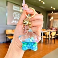 Star-shaped liquid quicksand keychain with blue beads and golden key ring attachment - Blue Colorful Bead Pentagram