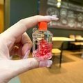 Close-up of mini bucket keychain with red star sequins and glitter inside - Luminous Bubble Beads Bucket (Without Keychain) / Red