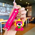 Pink Lotso bear keychain with strawberry charm and silicone strap on a gold metal ring - Strawberry Bear (Strawberry) / Soft Rubber Style - 1 Piece