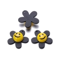 Detail view of sunflower charms with matte black petals and glossy yellow smiley faces - Black (29x29mm)