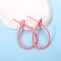 Detailed view of pink cat paw silicone cable ties on a stone tray for organization - Cat Paw / 2 Pcs/Set / Pink