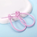 Close-up of pink flower silicone cable ties with flexible beaded strap on blue background - Plum Blossom / 2 Pcs/Set / Light Purple
