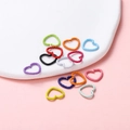 Close-up of textured heart-shaped open jump rings in assorted matte paint colors for DIY - 12x14mm/Thickness 1.5mm (50 Pieces/Pack) / Multicolor