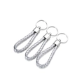 Detailed view of silver braided leather keychains with metallic gloss finish and ring - 5 Pieces / Silver