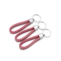Detailed close-up of three rose red and beige woven leather cords with silver keyrings - 5 Pieces / Rose Red Khaki