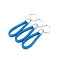 Close-up of three blue braided leather keychains with polished silver metal rings - 5 Pieces / Lake Blue