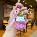Pink lucky cat keychain with liquid quicksand stars and a sweet heart wrist strap - Glow in the Dark / Pink
