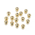 Gros plan de perles pleines en or 14K poli avec trous pour la création de bijoux DIY - 2mm (100 Pièces/Paquet) / Or KC