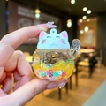 Cute Maneki Neko liquid keychain with yellow glitter and floating floral charms - Luminous Style (Without Buckle) / Orange