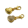 Macro shot of gold heart charms with crystal pavé and lobster claw clasps for jewelry DIY - Gold