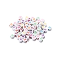 Macro shot of white acrylic round beads with colorful printed letter R for DIY jewelry making - Style R / 7mm (100 Pieces/Pack)